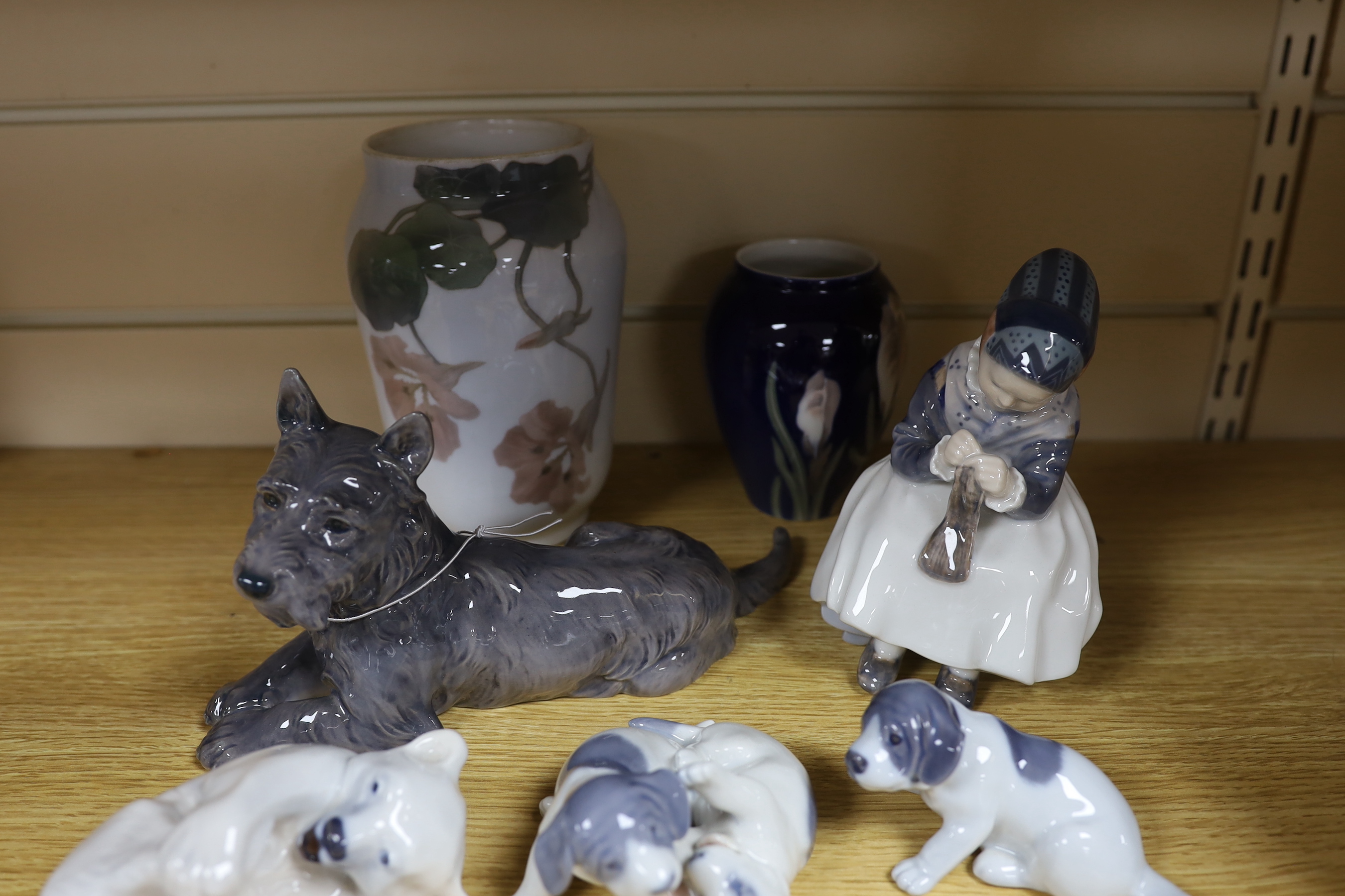 Four Royal Copenhagen figures and animals, two similar vases and a Bing and Grondahl terrier